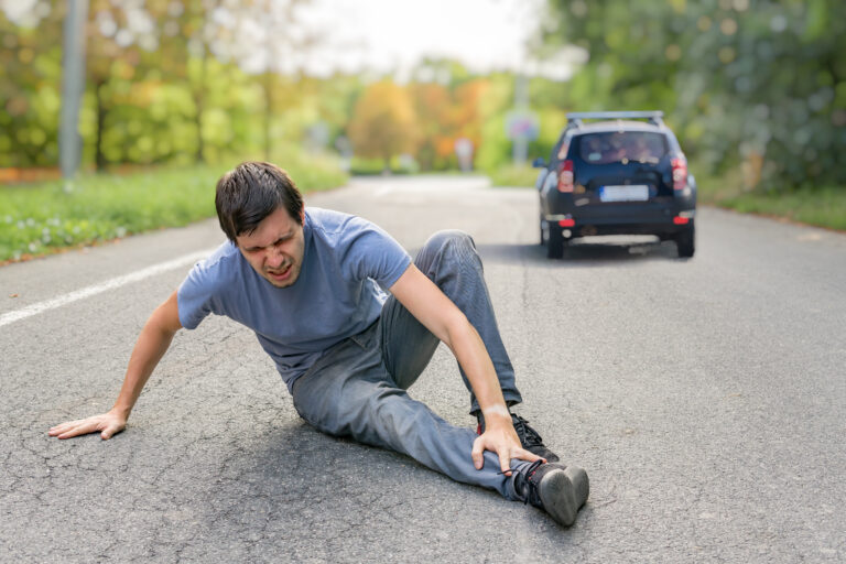 Hit,And,Run,Concept.,Injured,Man,On,Road,In,Front